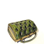 green leather handbag